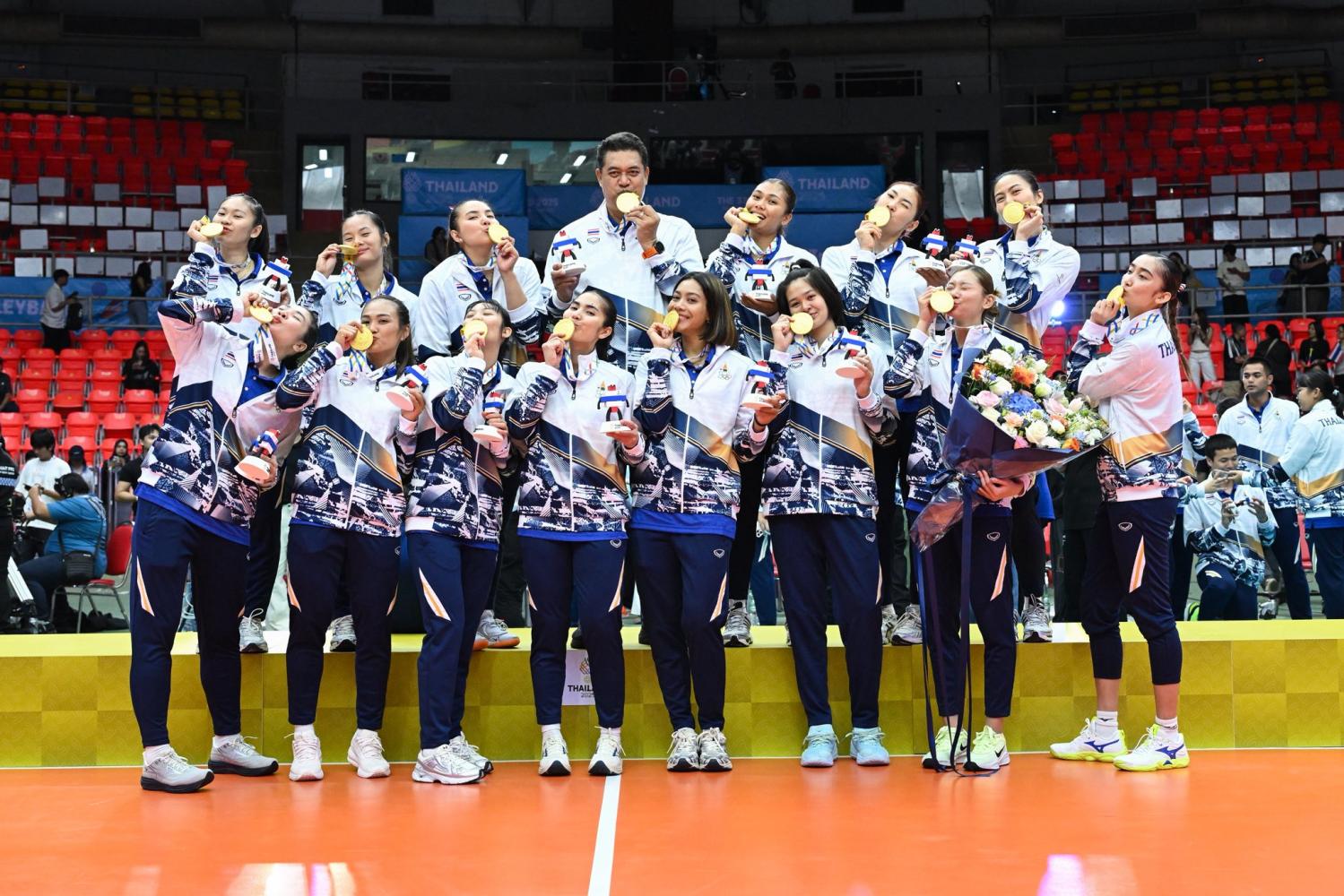 The Thai women's volleyball team celebrate with their SEA Games gold medals. The Thai Volleyball Association Thai Volleyball Association