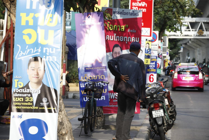 Banker slams parties' household debt vows