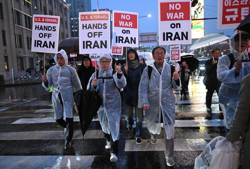 This photo from yesterday shows protesters carrying placards reading 'Hands off Iran' as they march towards the US embassy during a rally condemning the US and Israeli attacks on Iran in Seoul, South Korea, one of the US's strongest allies in Asia. (Photo: AFP)