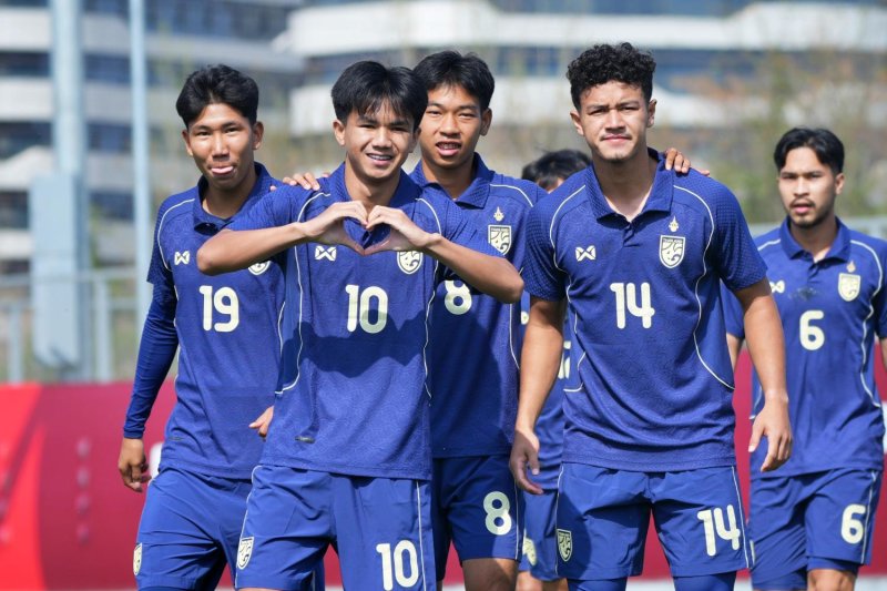 Lucky Strike: Thailand's Thanakrit Chotmuangpak, No.10, celebrates his goal with teammates.