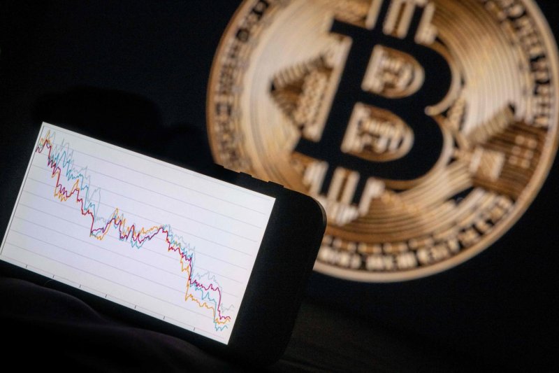 Even though the cryptocurrency market could tumble in June, Bitcoin remains attractive for gradual accumulation due to several supportive factors, says Mr Woramet. (Photo: AFP)