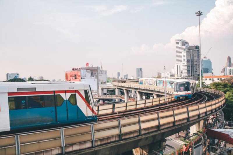 Skytrain carriages depart from and arrive at Victory Monument station in Bangkok. The government plans to buy back rail concessions to help reduce fares.