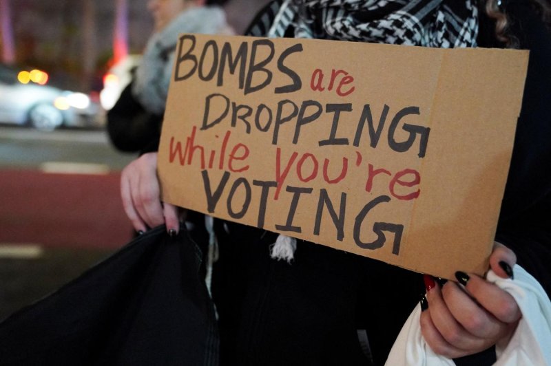 This photo, dated Dec 8, 2023, shows a person holding a placard during a protest outside the UN headquarters in New York City, as United Nations Security Council members meet to address the humanitarian crisis amid the conflict between Israel and the Palestinian Islamist group Hamas. (Photo: Reuters)