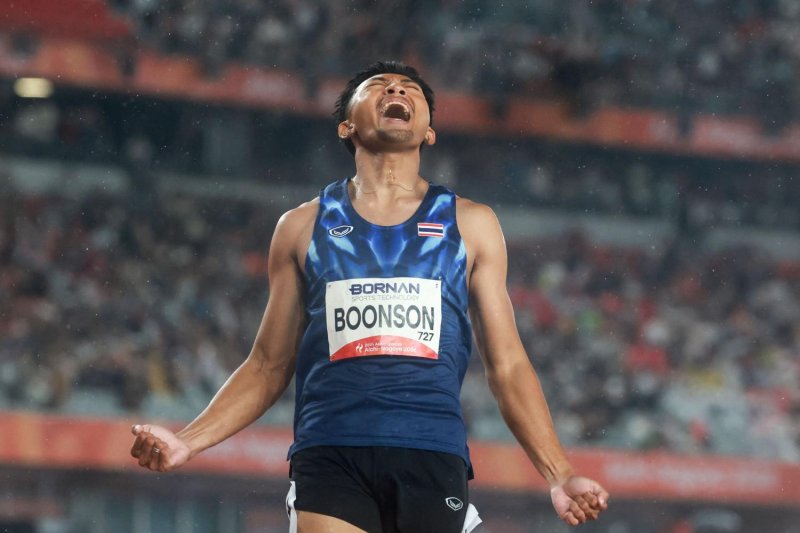 Puripol Boonson celebrates after winning the men's 200m final. AFP