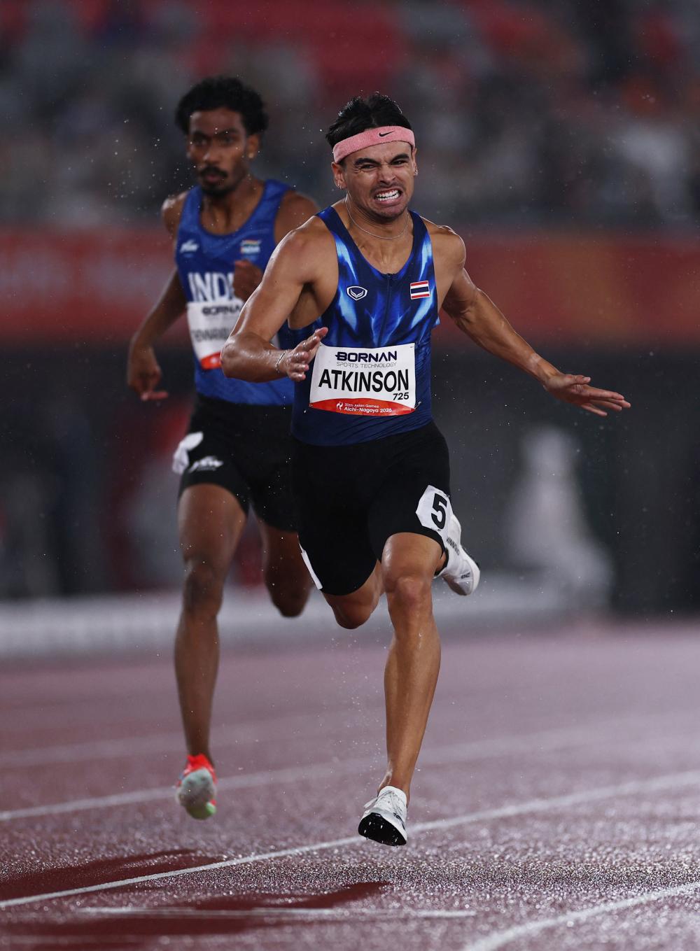 Joshua Atkinson crosses the finish line to win the men's 400m final. REUTERS