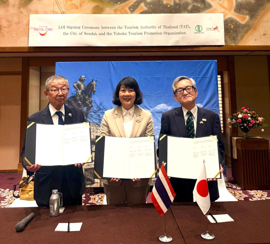 Akira Fujimoto, left, deputy mayor of Sendai City, Ms Pattaraanong, centre, and Shigeru Matsuki, president of the Tohoku Regional Tourism Organisation, sign a renewed letter of intent to promote two-way tourism.