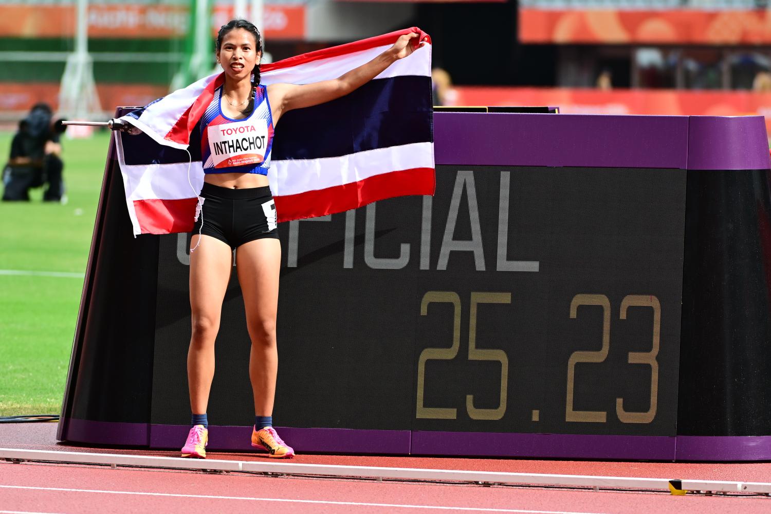 Sasirawan Inthachot with the Thai flag after winning the women's 200m T47 in a Games record time of 25.23sec. PR