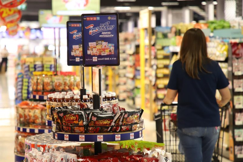 A consumer shops in a supermarket. The regulator is concerned about market concentration in the modern trade industry. Varuth Hirunyatheb