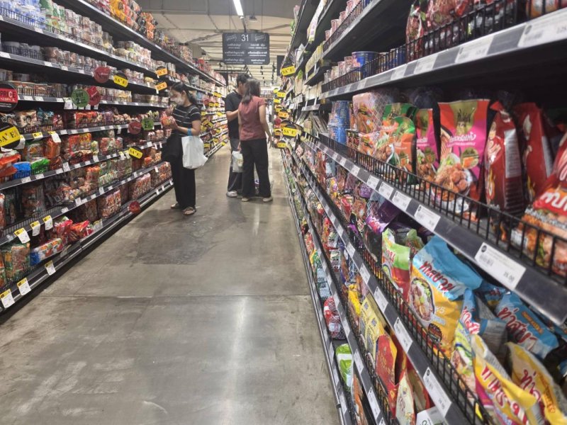 Shoppers browse for goods at a Bangkok supermarket.