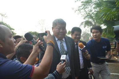 Construction tycoon Premchai Karnasuta, centre, arrives at the Thong Pha Phum court in Kanchanaburi province on Tuesday morning