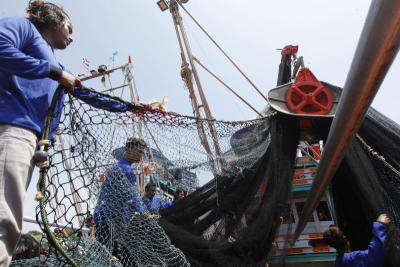 As trawlers mechanise to beat tighter fishing rules and labour shortages, fears are growing in Pattani that smaller boats could soon go out of business